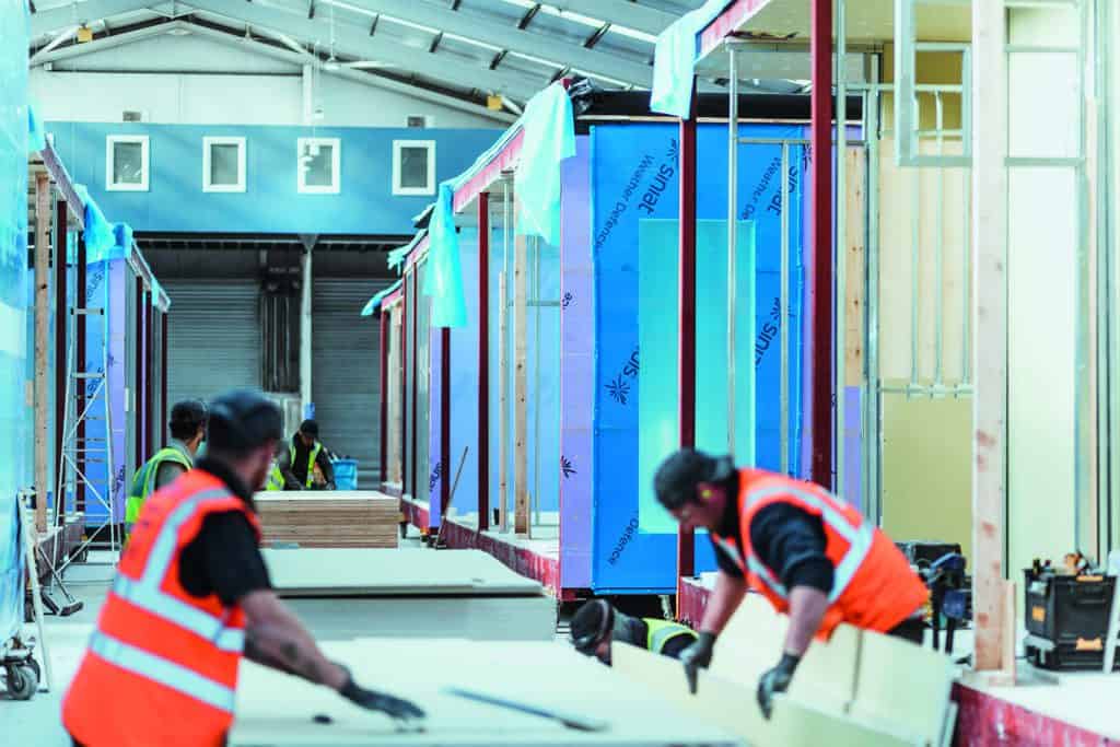 Premier Modular Construction Workers, working on an offsite construction building in the factory. 