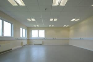 Inside view of an empty room in a modular prison facility. 