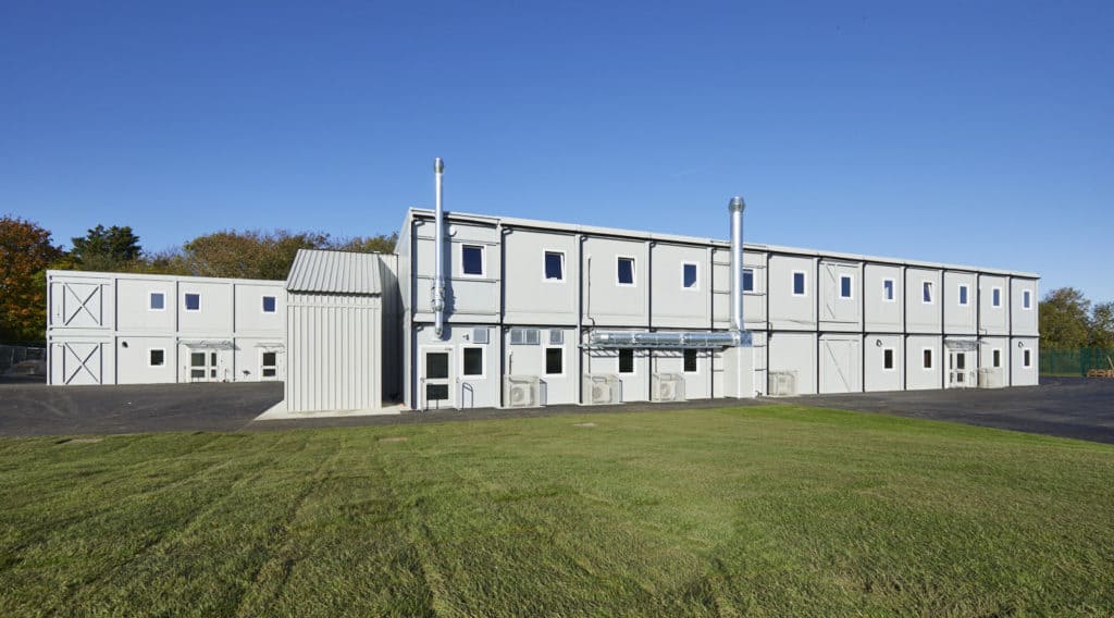 Front view of temporary school building built for Bradsfield Academy