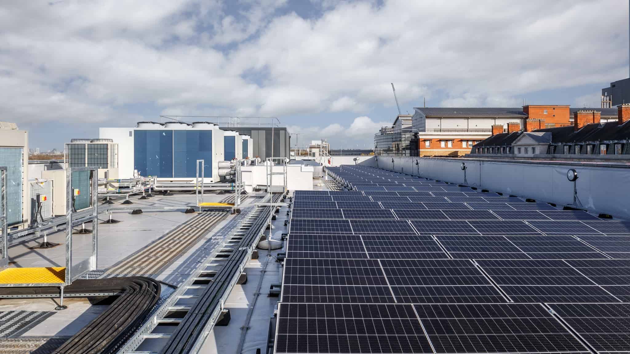 On the roof of a modular building, solar panels lay across, providing a more energy efficient solution.