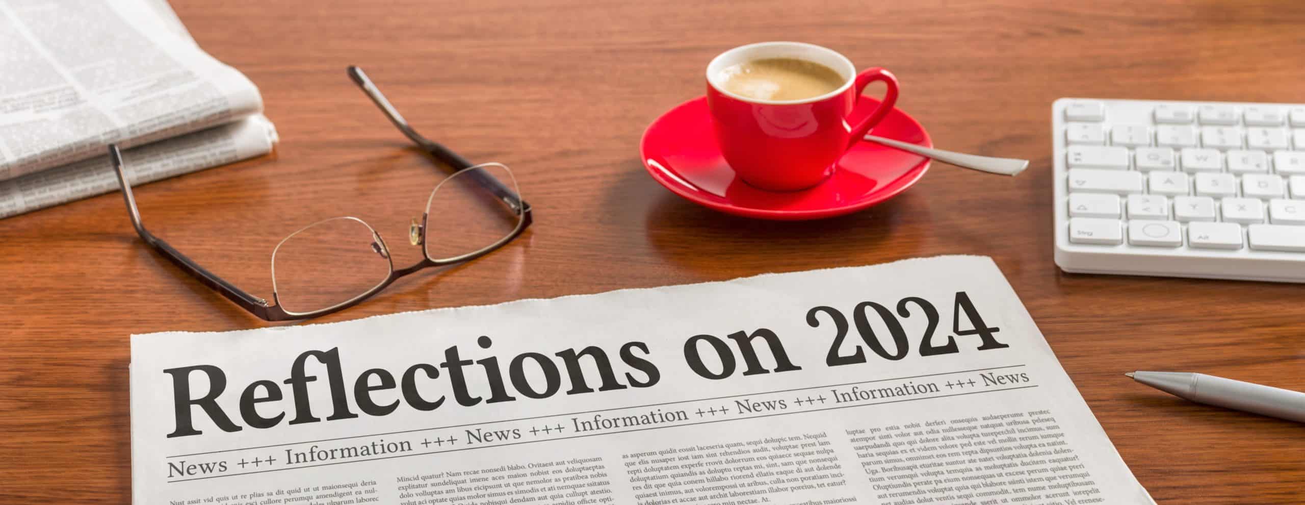 A,Newspaper,On,A,Wooden,Desk,-,Reflections,On,2024