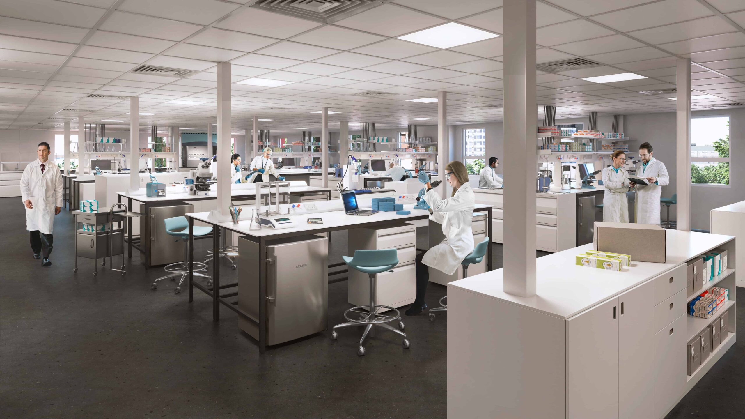 The science labs with equipment in and people doing work. Labs are part of offsite building solutions offered by Premier Modular. 