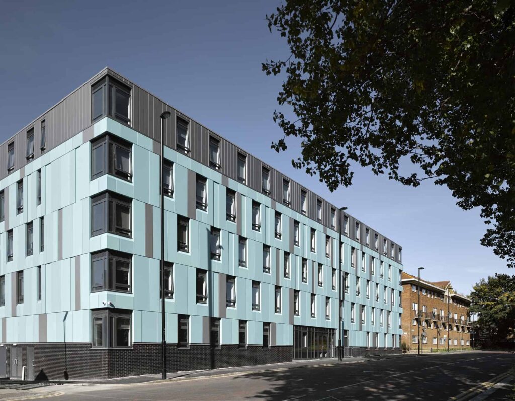 Outside view of Newcastle University modular student accomodation. Light blue walls. 