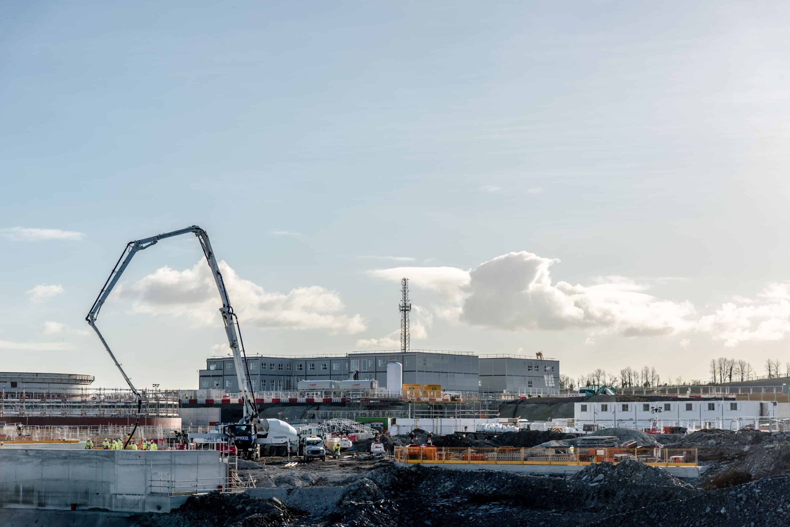 Modular building in construction. Crane picking up a unit. 